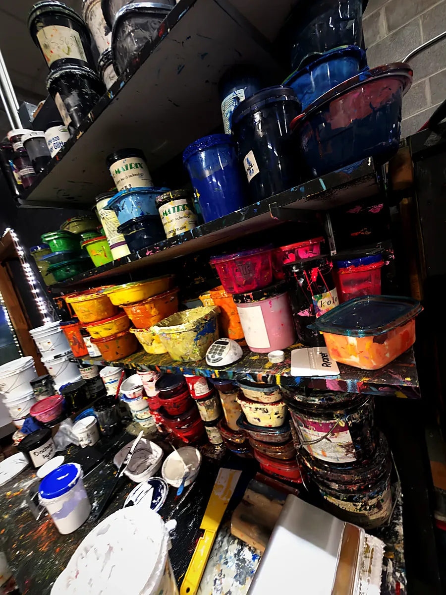 Shelves of plastisol ink in every color of the rainbow