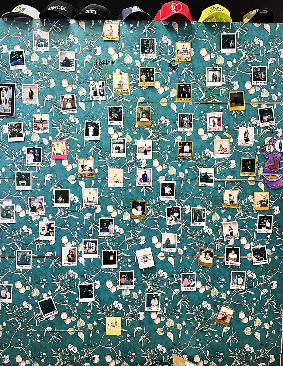 Polaroid wall of Humanitees customers and friends